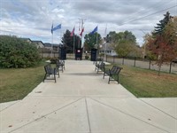 sidewalk & benches leading to the memorials.